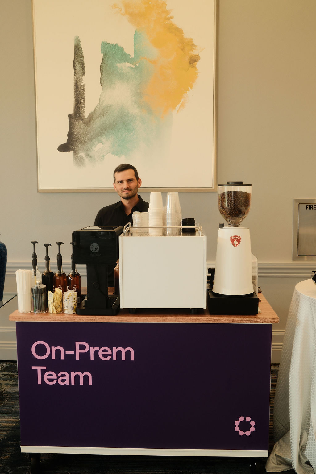 Cyera On-Prem Team branded coffee cart with barista at the Waldorf Astoria Orlando