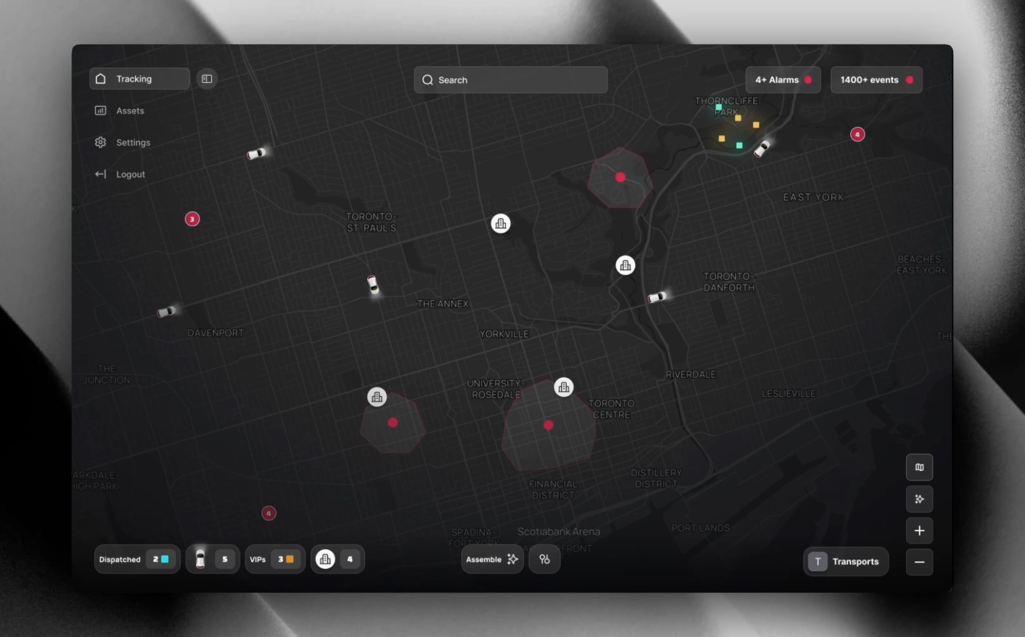 Dark-themed desktop map dashboard displaying vehicle and event icons across a city layout, with filters for tracking, settings, assets, and alarms.