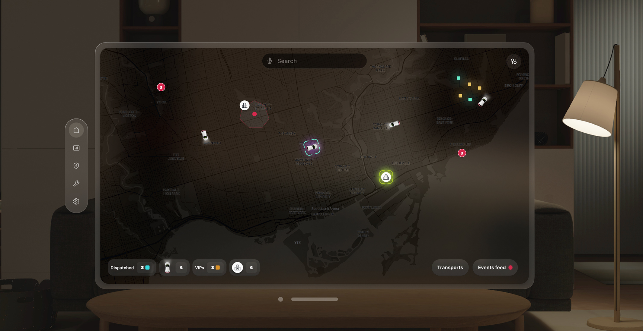 Laptop displaying full AVP dashboard with cars and map controls.