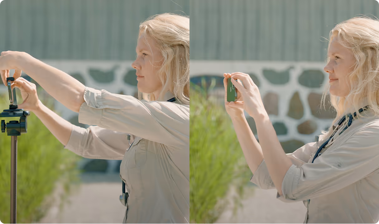 A woman outdoors setting up and then using a smartphone mounted on a tripod in a sunny environment.