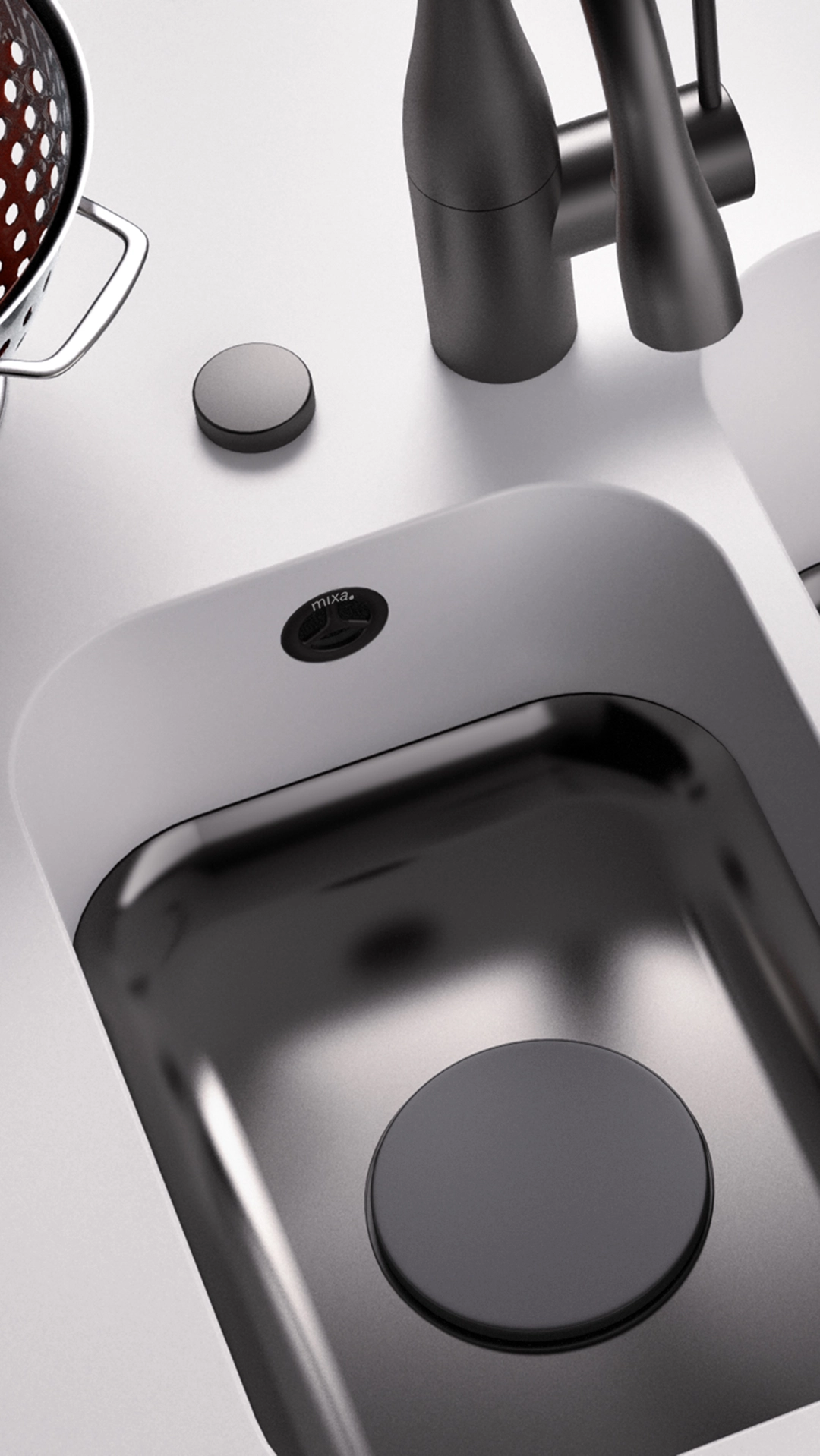 Modern kitchen sink with a matte black faucet, a black covered drain, and a white countertop with a metal colander to the side.