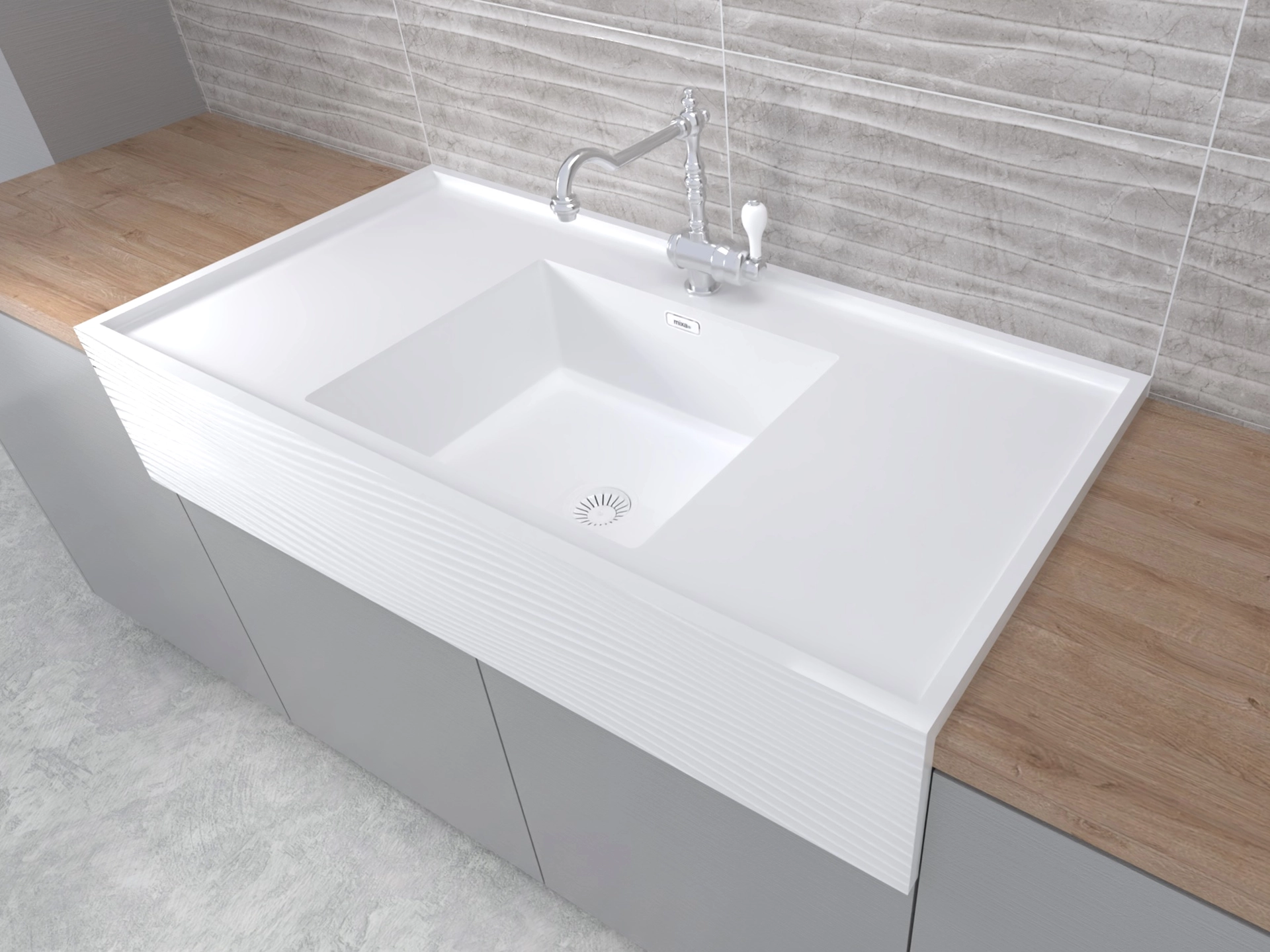 Modern white rectangular kitchen sink with a silver faucet, set into a wooden countertop and grey cabinetry.