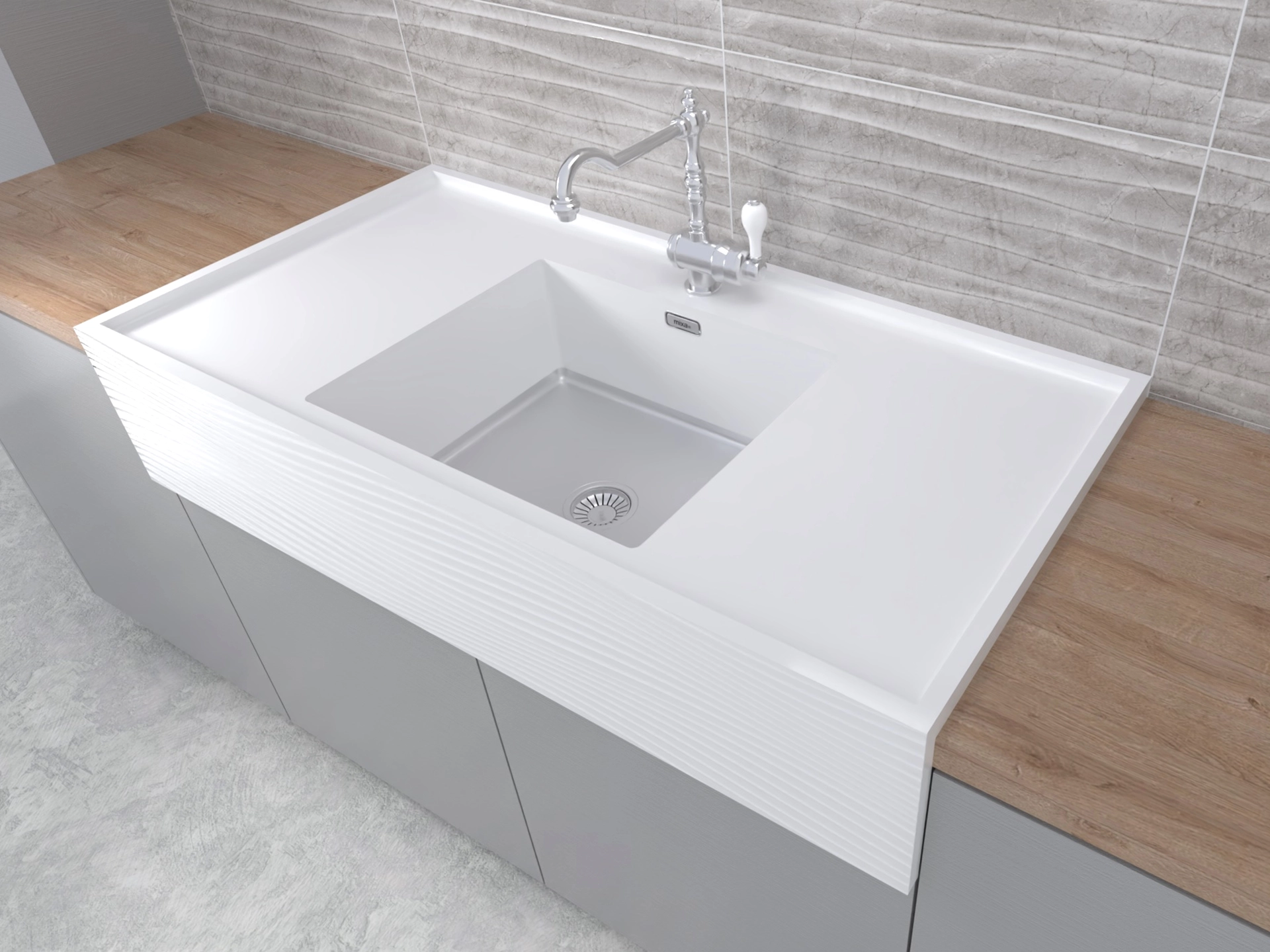 Modern white rectangular sink with a chrome faucet set in light wood countertop and gray cabinetry below, against textured gray tile wall.