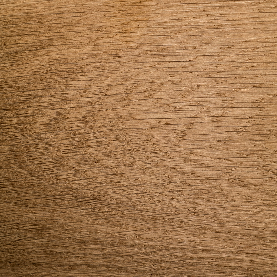 Close-up of a smooth wooden surface with natural grain patterns.