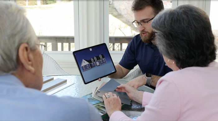 during a client consultation discussing the clients roofing options for their home in Wilmington NC