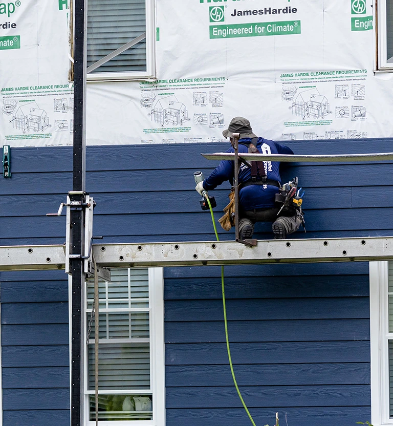 Capitol Improvements crew installing James Hardie Siding - Deep Ocean