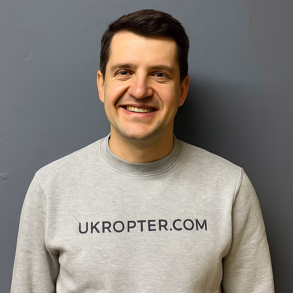 Portrait of a team member wearing a UKROPTER.COM sweatshirt, front view.
