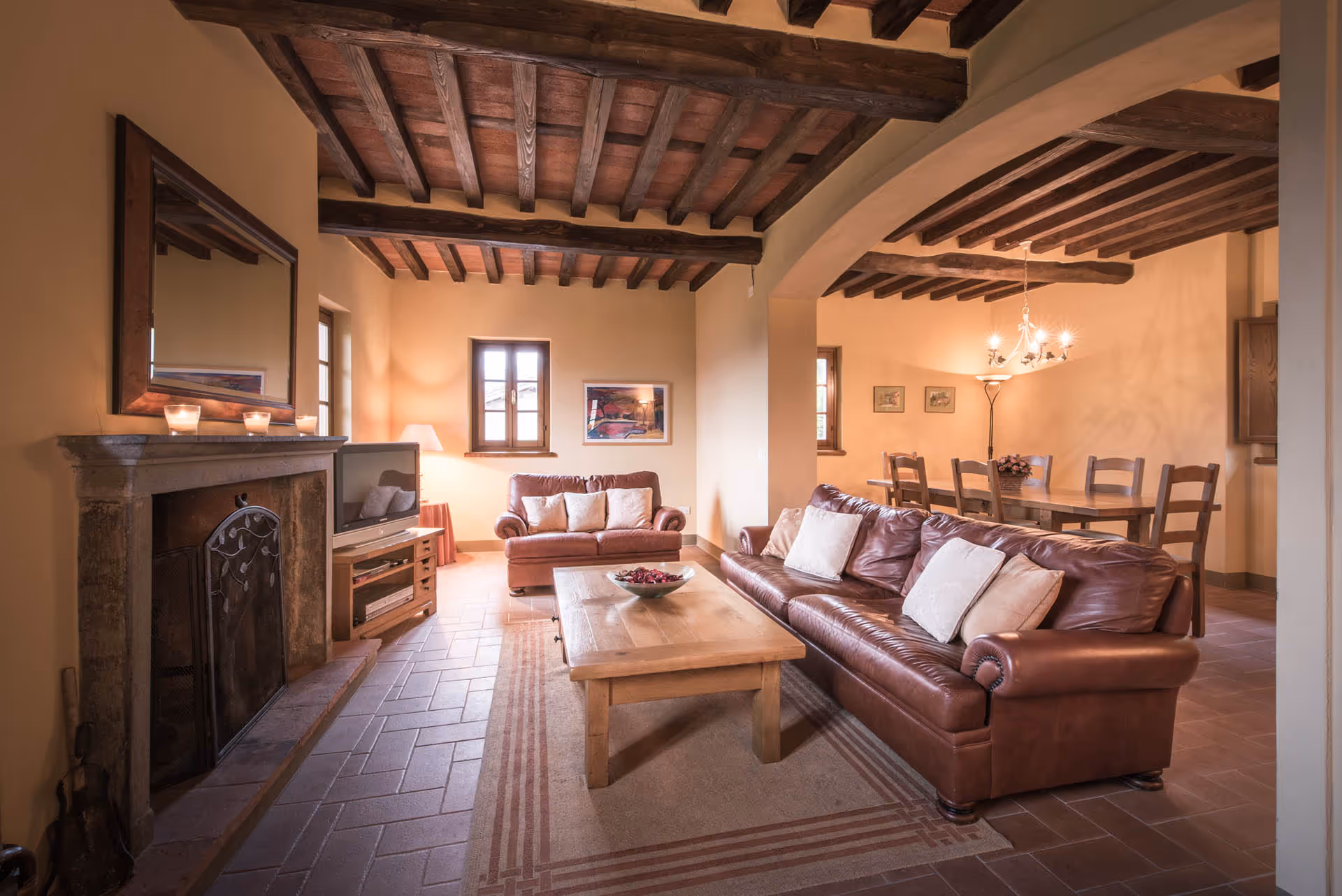 Rustic lounge with fireplace and vintage furnishings