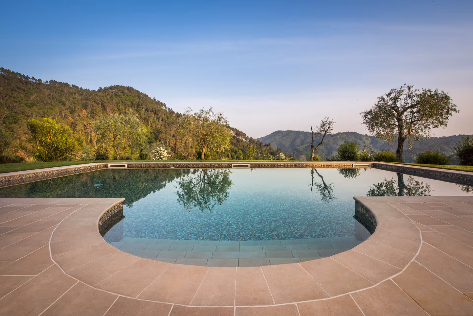 Round saltwater pool with panoramic countryside view