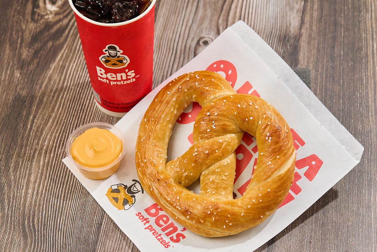 A photo os a Ben's Meal. Jumbo Soft Pretzel, Dip, and a drink