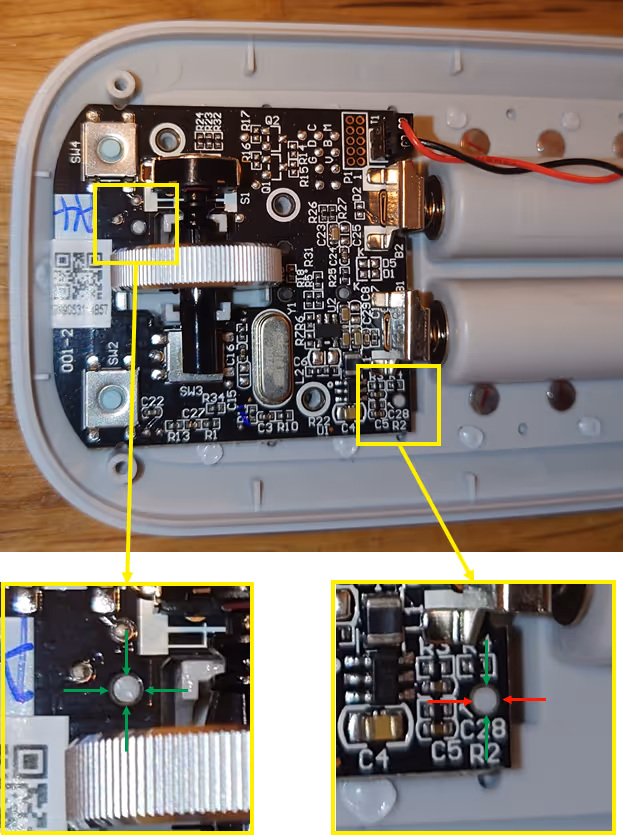 Internal circuit board of electronic device with zoomed sections showing solder points and components.