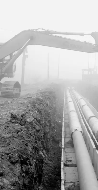 construction vehicle over long pipeline