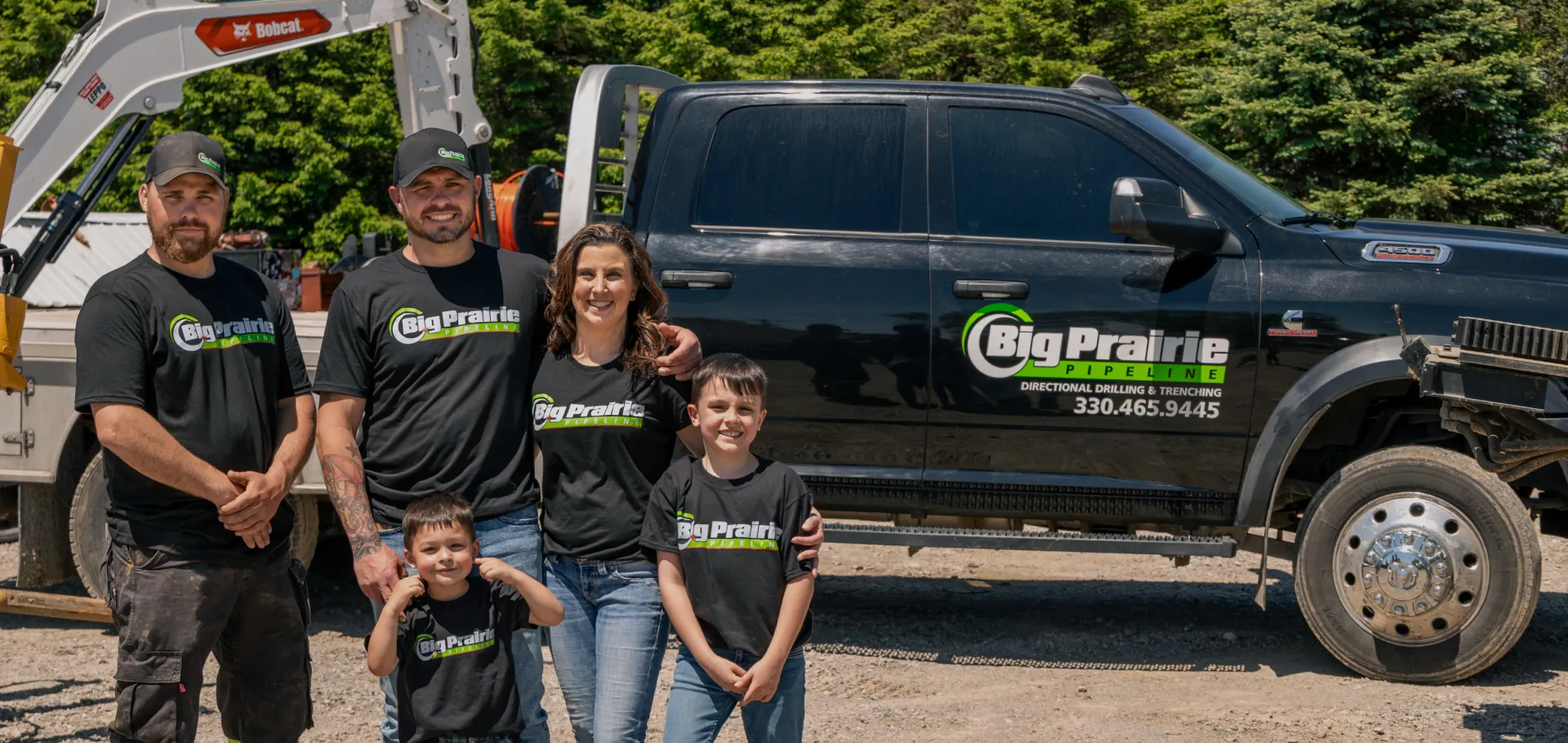 bpp family in front of branded truck