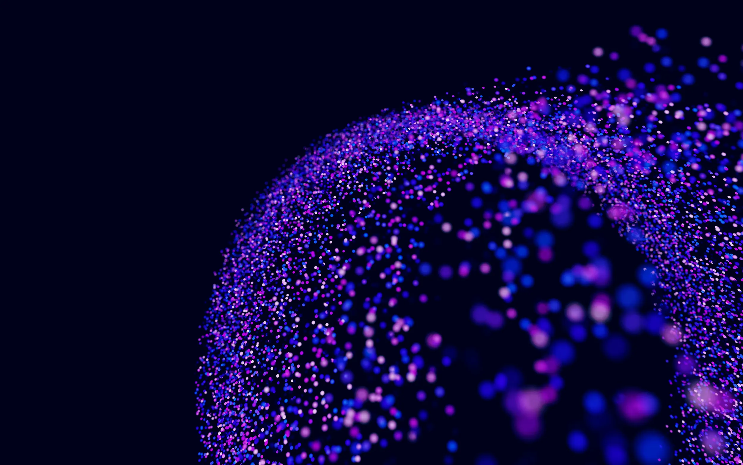 Abstract sphere of glowing blue and purple dots against a dark background.
