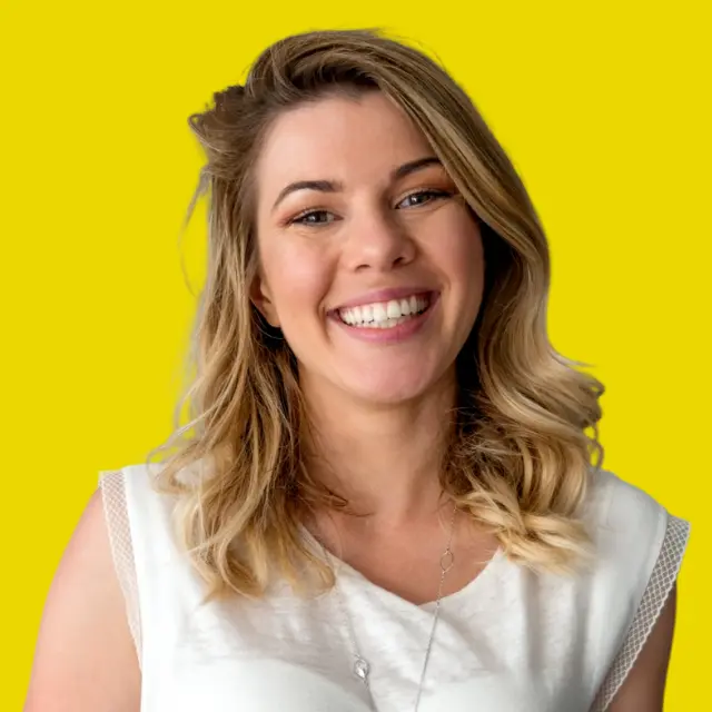 Blonde CEO smiling professional photo