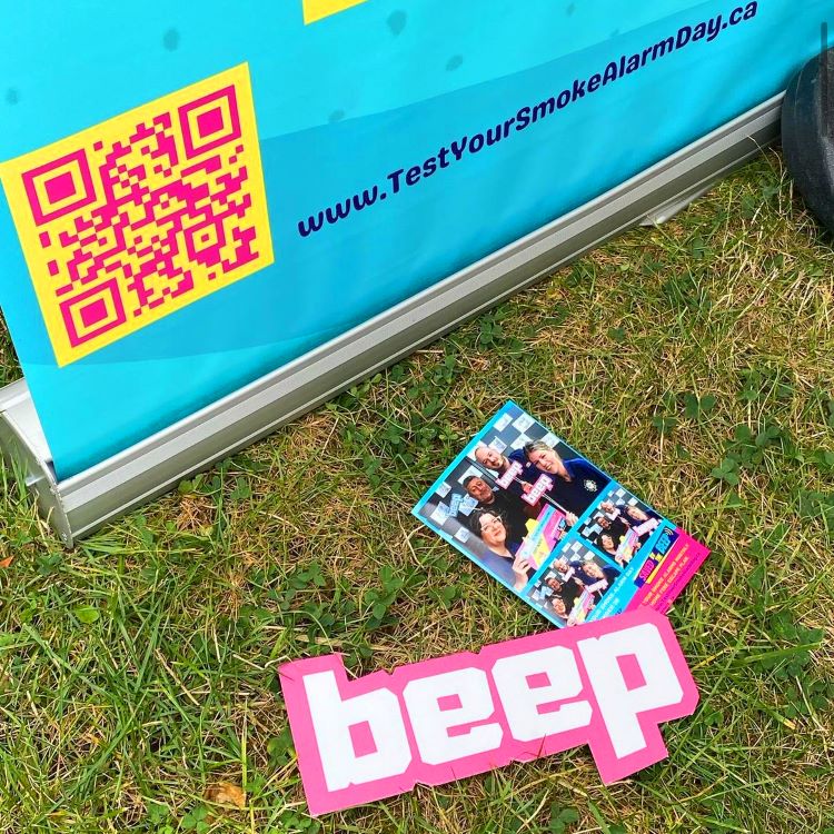 image of saved by the beep promotional materials, including a cutout of the word "beep".