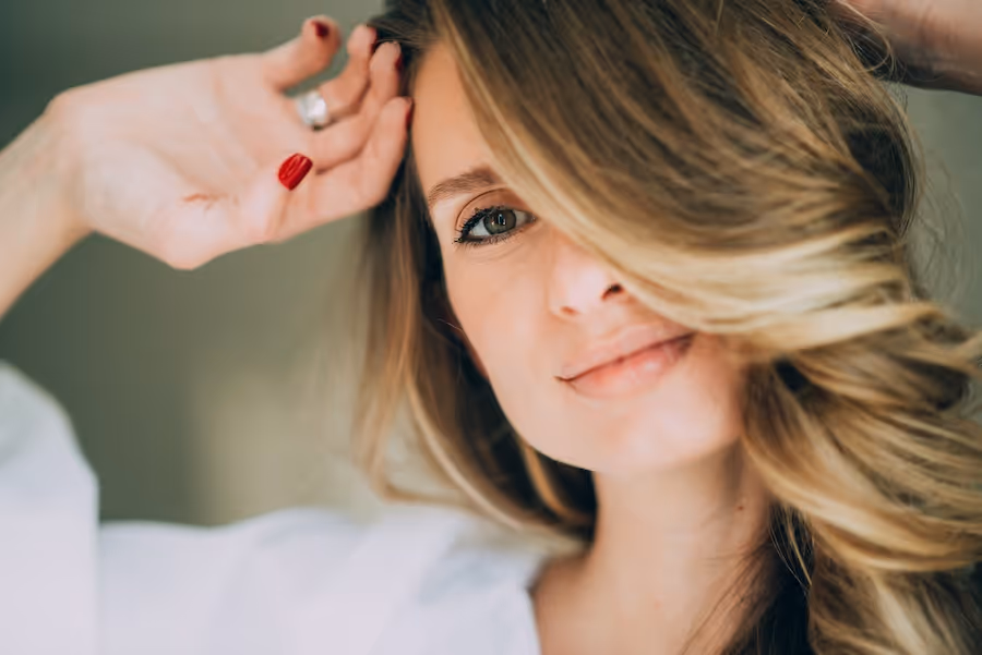 A close up of a woman with long hair.