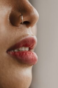 Woman side profile. showing only her nose and lips
