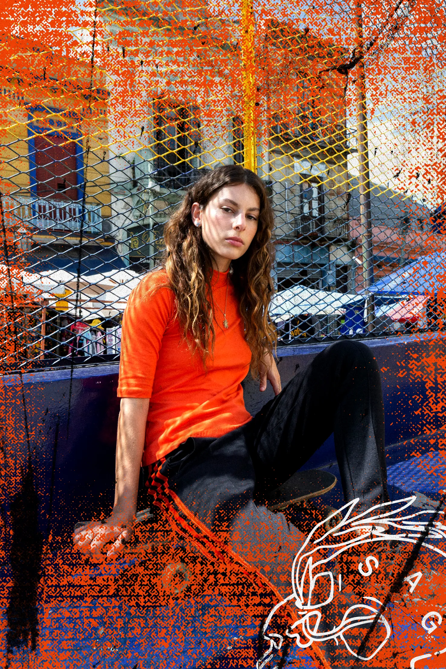 Teen girl sitting on ground looking into camera.