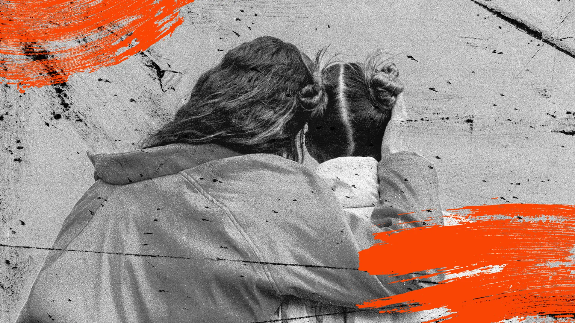 Two young friends embrace