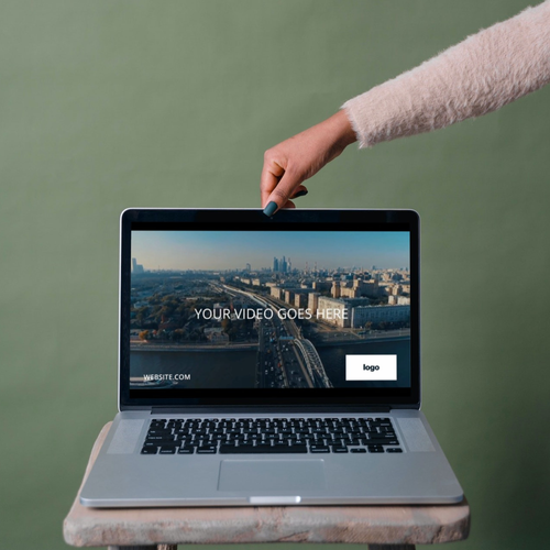 someone using a computer to edit a video template