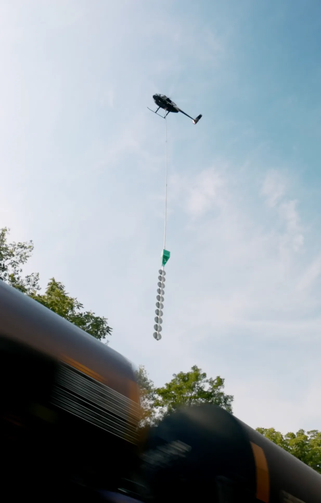 Image of Livewire doing vegetation management with an aerial saw