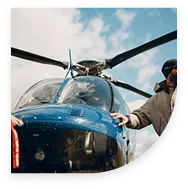 Person standing next to a helicopter