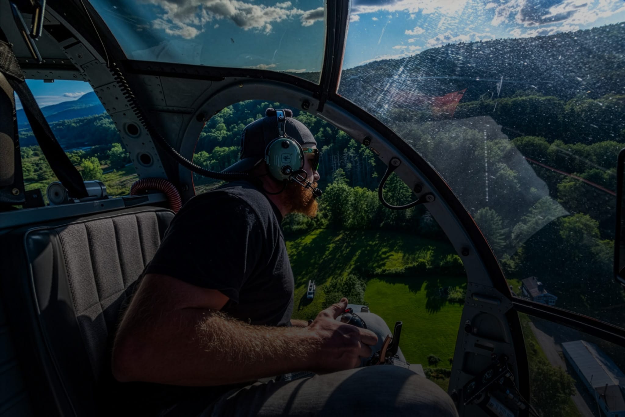 Pilot in a helicopter looking down