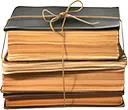 stack of old books bound by string