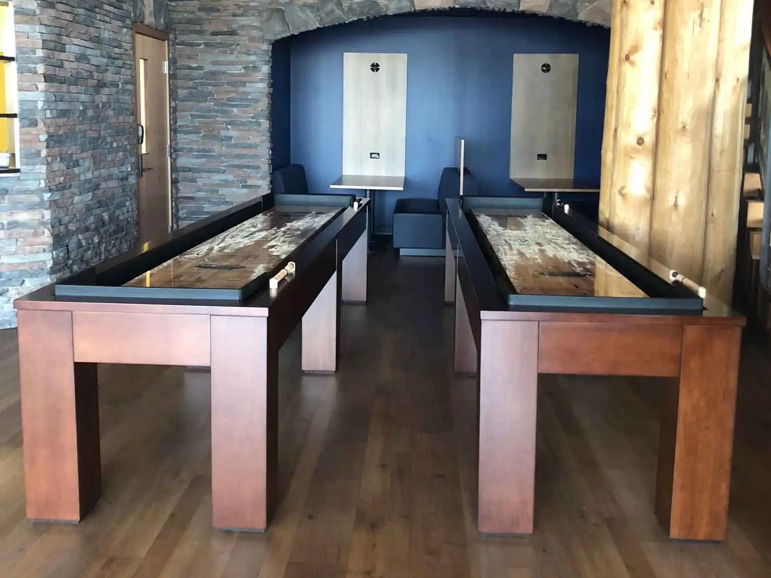 two shuffleboard tables in a bar