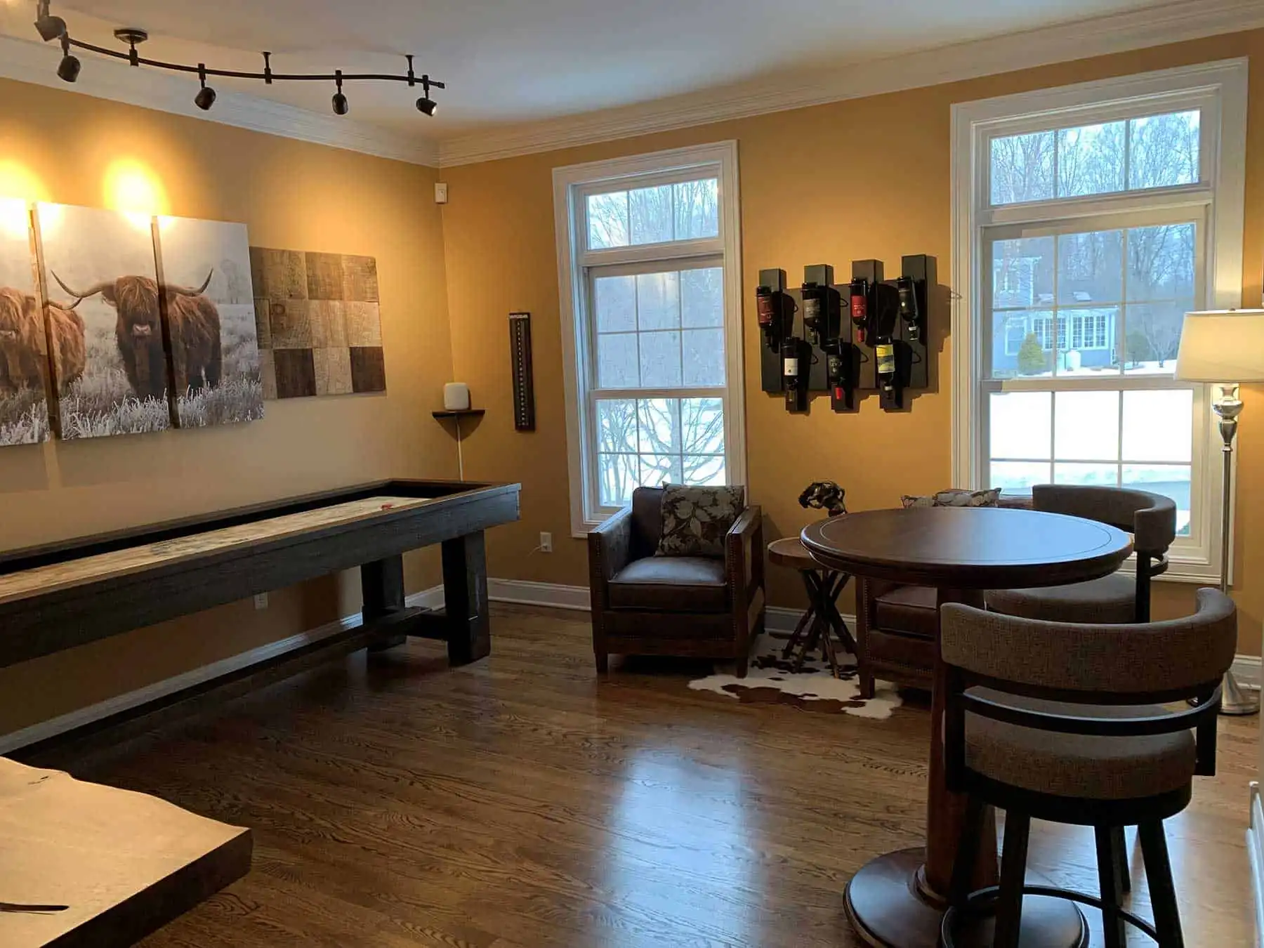 room with a shuffleboard table against the wall