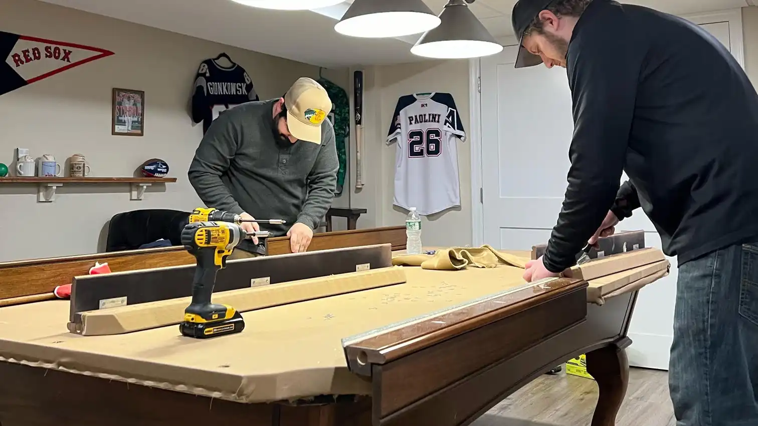 Putting together new pool table bumpers and rails