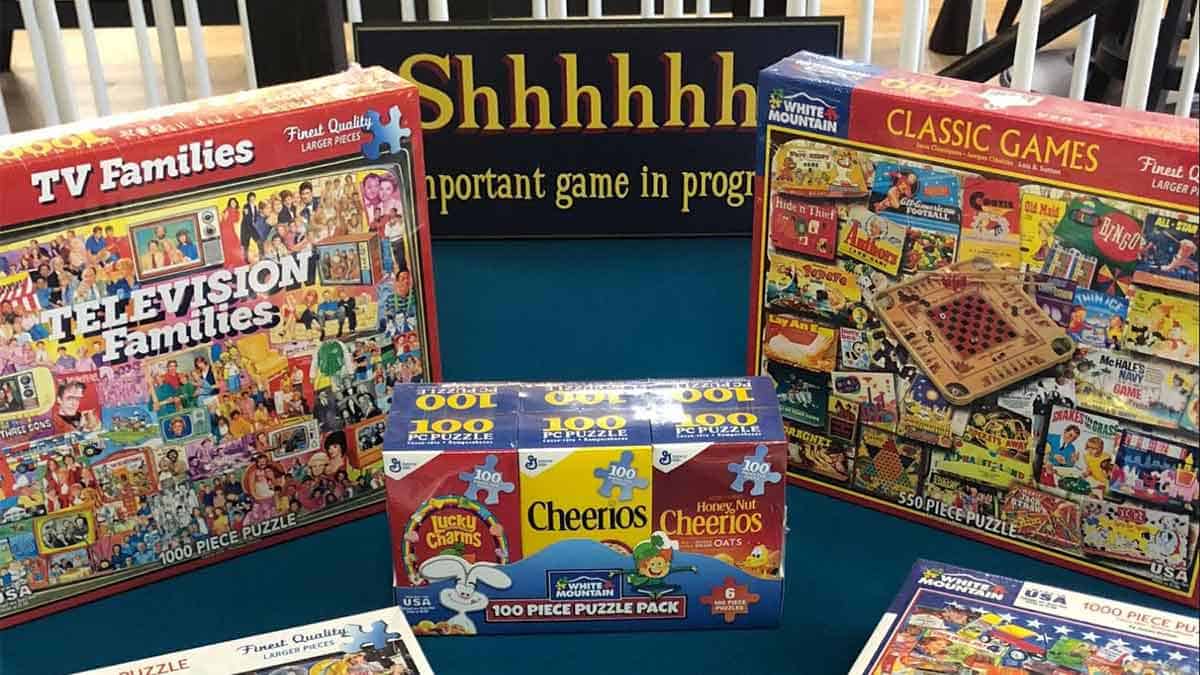 puzzles being used by adults in game rooms