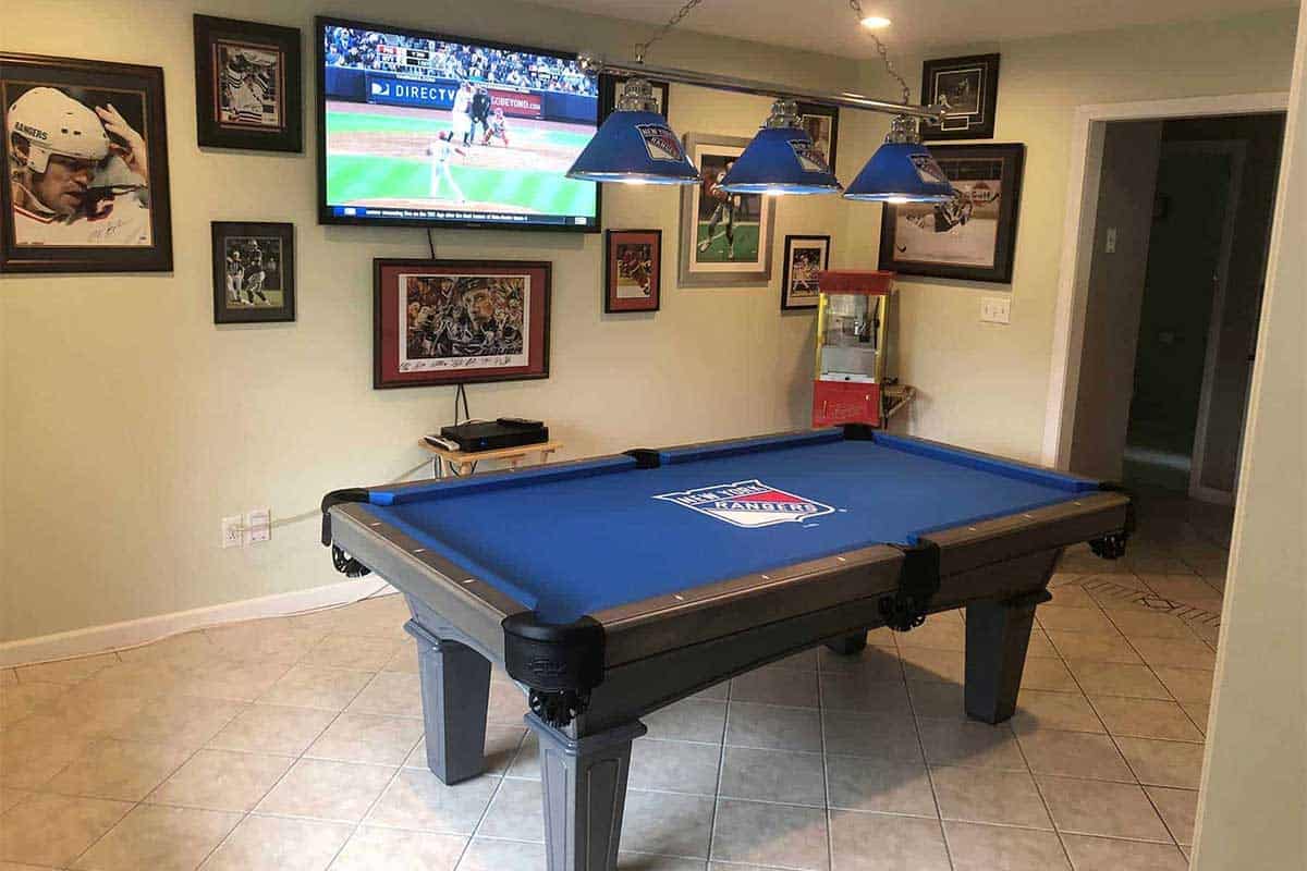 sports room with rangers stuff and rangers pool table|pool room with wall decor, dart board and lighting||