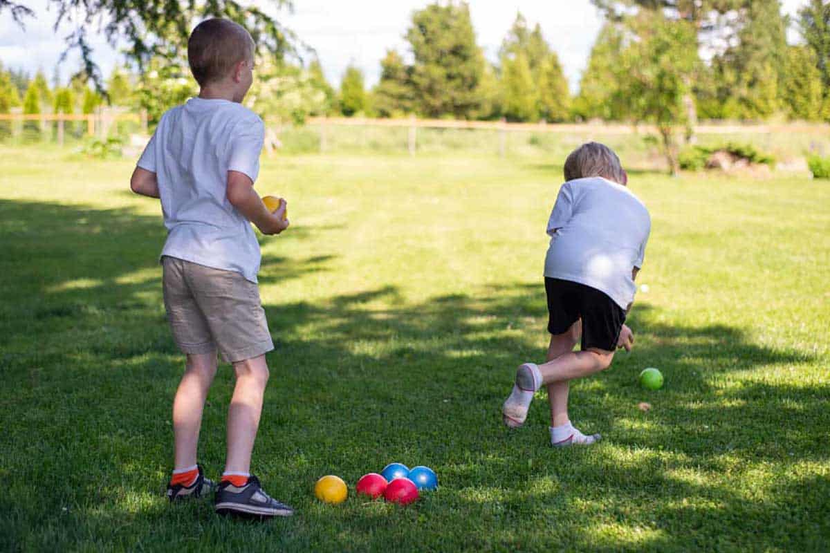 kids playing bocce|championship series bocce set|bocce balls in the grass
