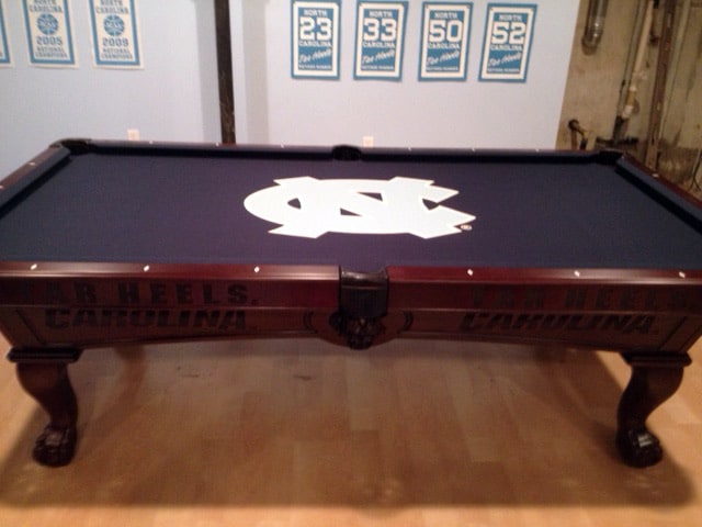 dark blue black pool table with custom logo