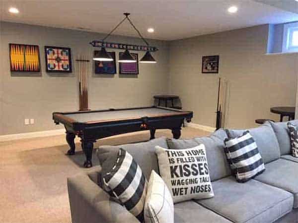 pool room with wall decor, dart board and lighting