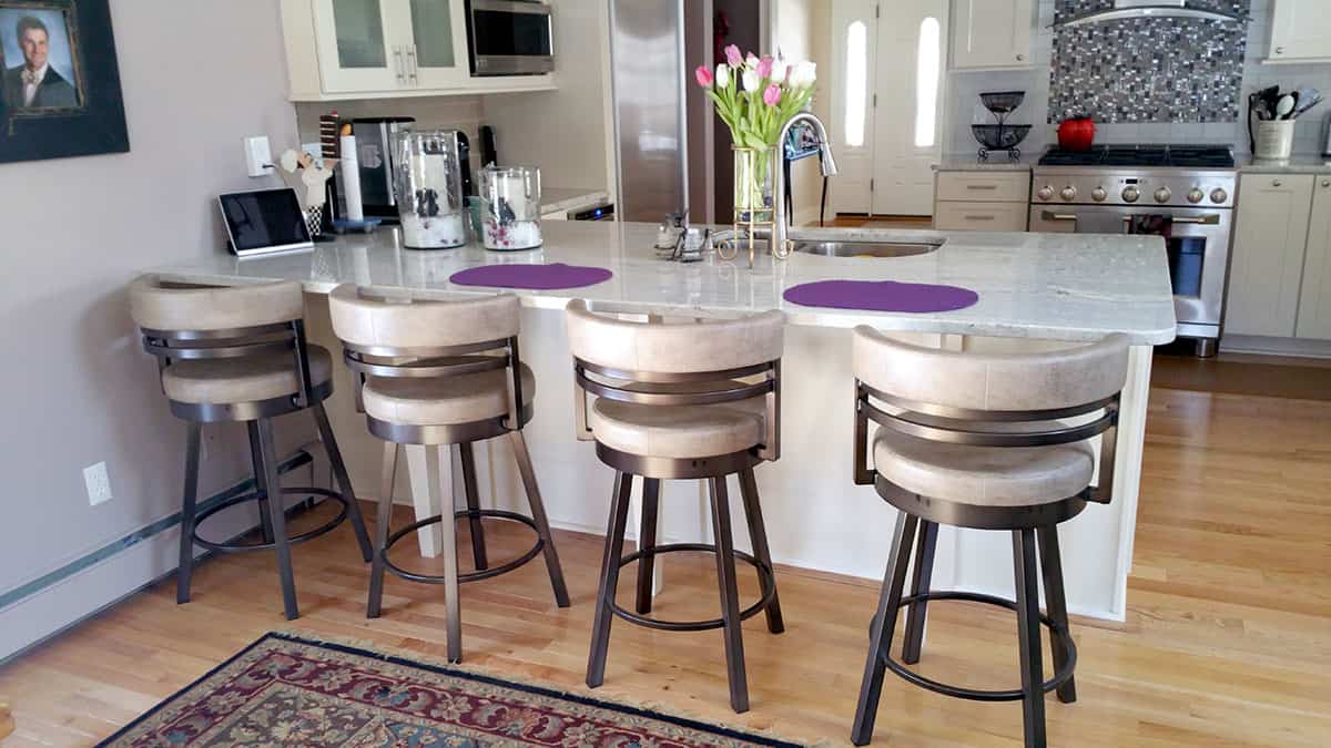 four white kitchen stools