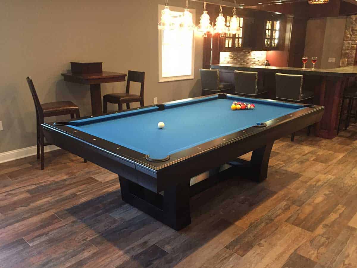 green blue pool table and bar stools