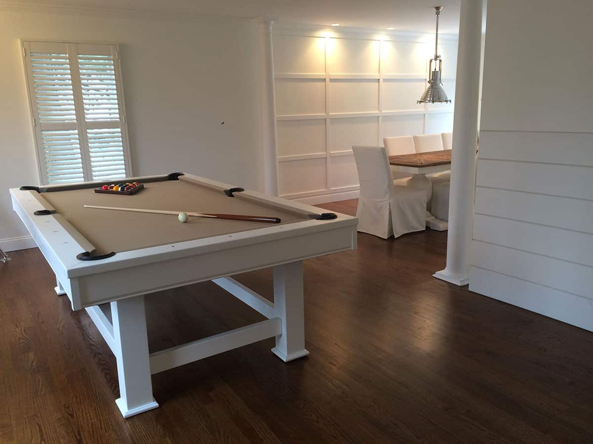 tan brown pool table in a white room