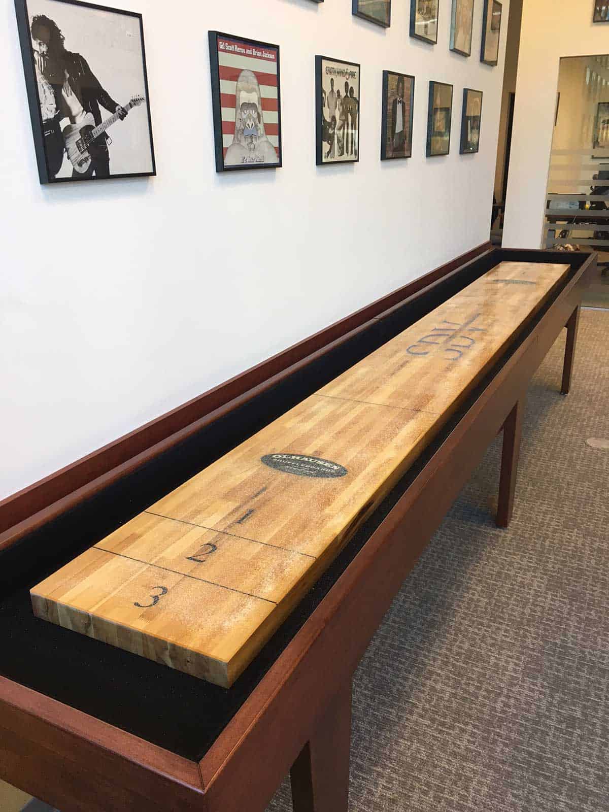 olhausen shuffleboard with posters on the wall