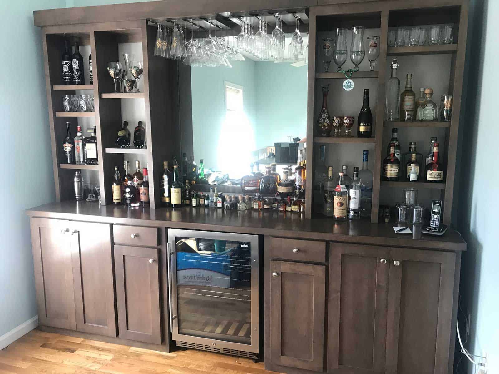basement bar with wine refrigerator