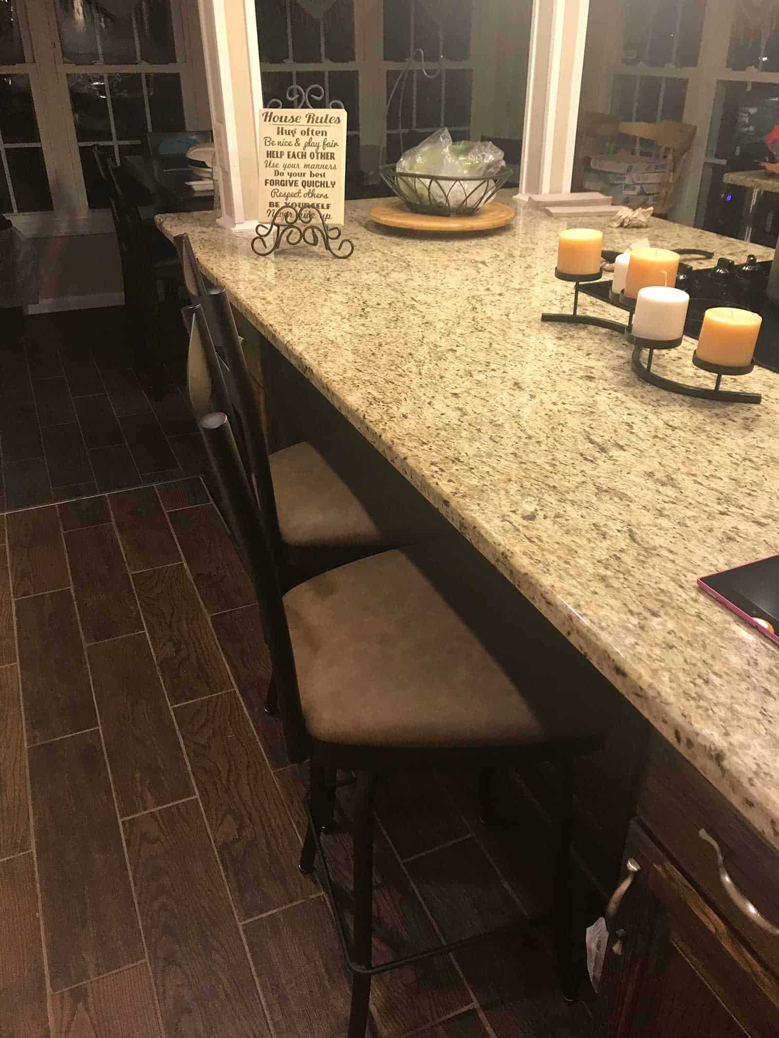 brown kitchen stools with marble counter