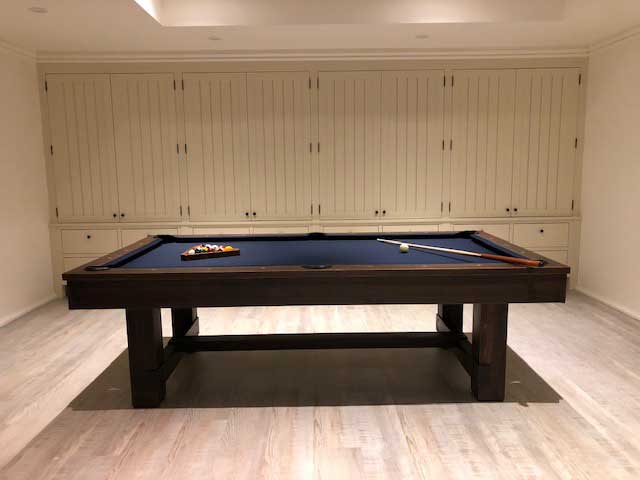 blue pool table with built in cabinets