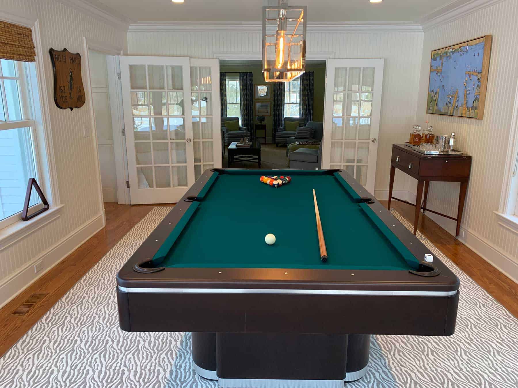 green pool table grey and white rug