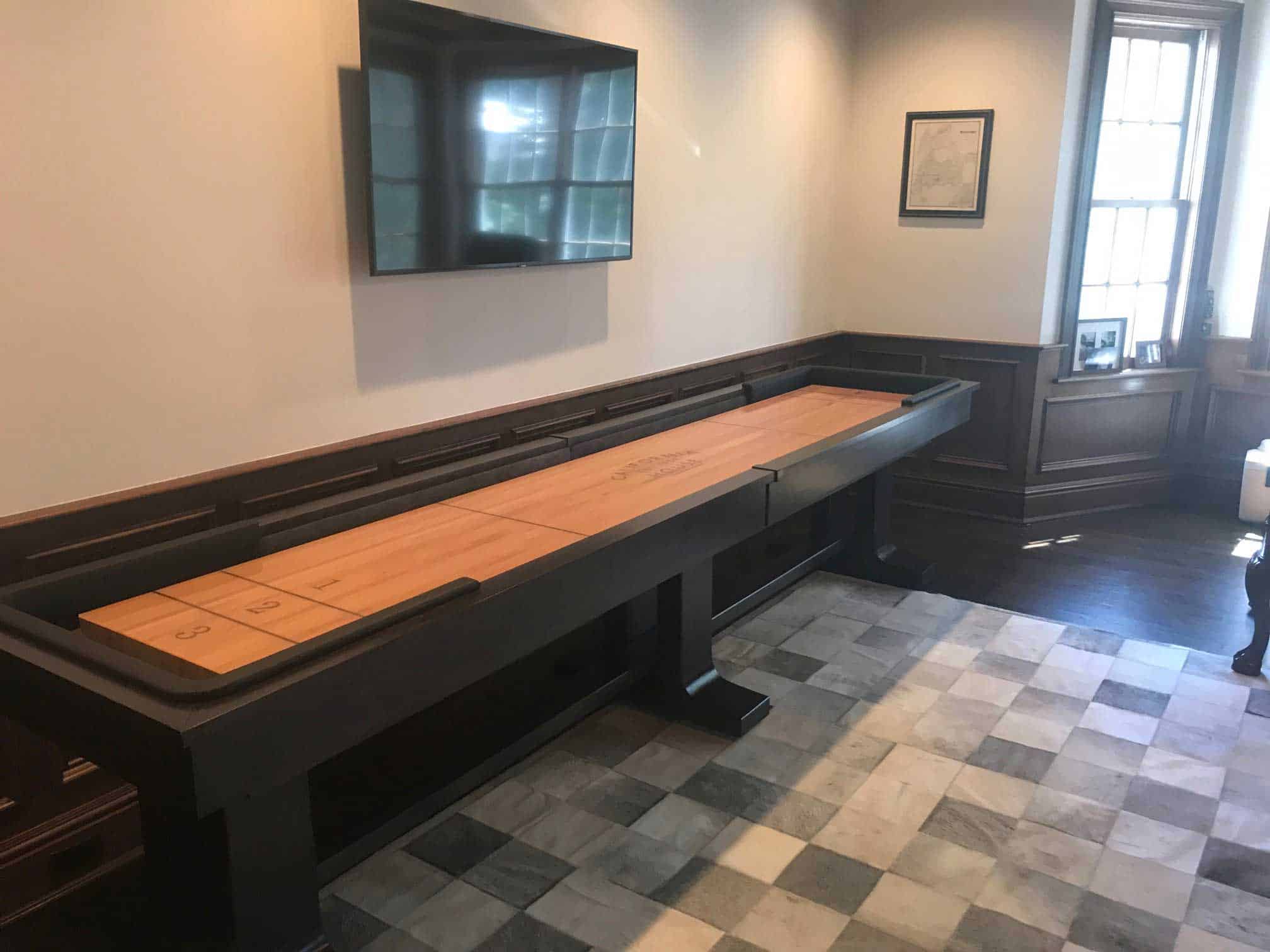 shuffleboard table with black railings