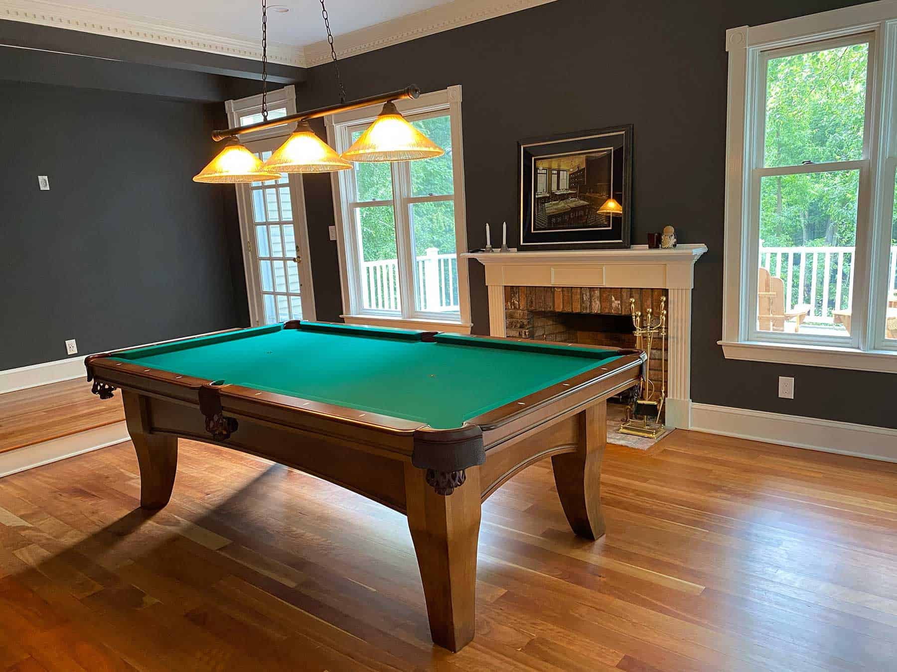 green pool table in a slate blue room in Roxbury