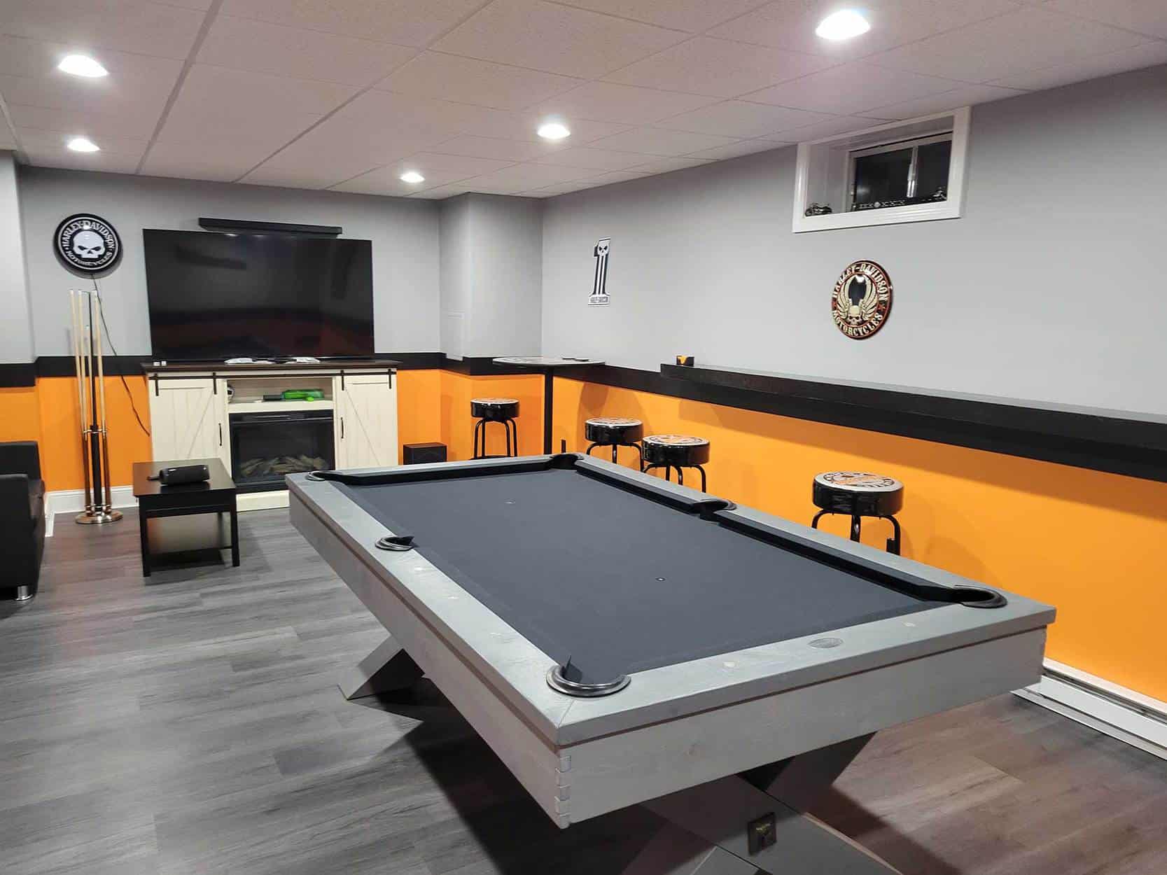 grey pool table orange walls