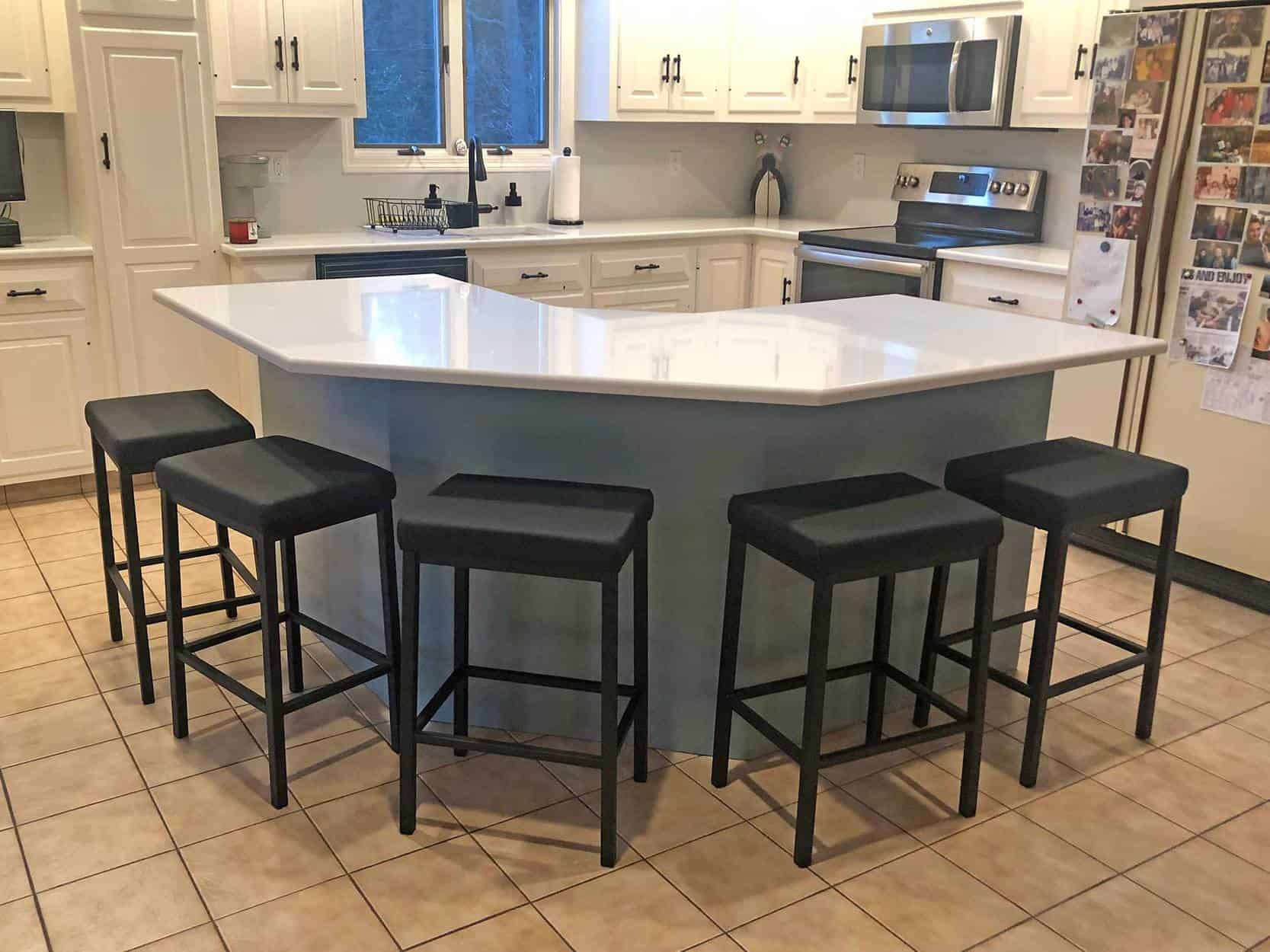 black kitchen stools at a kitchen island