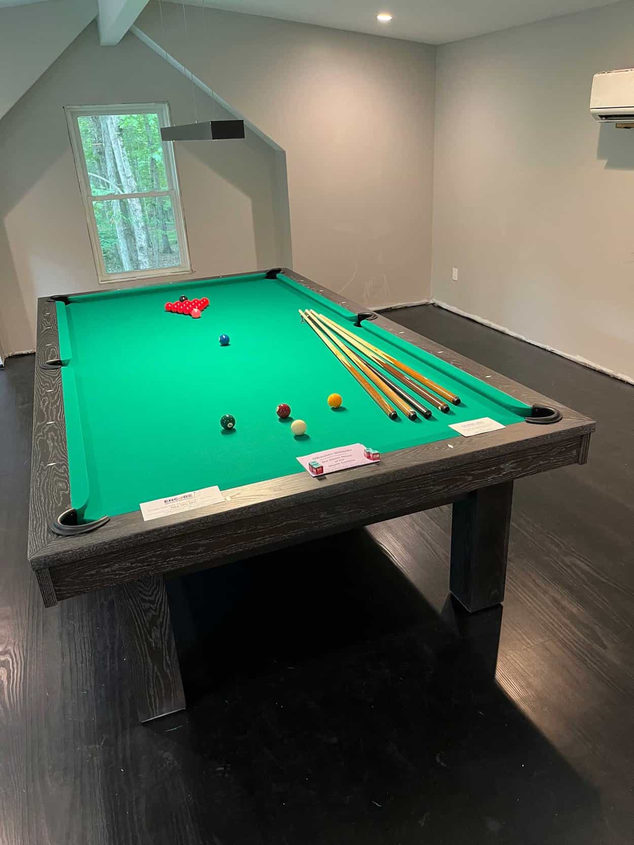 green pool table with billiards balls